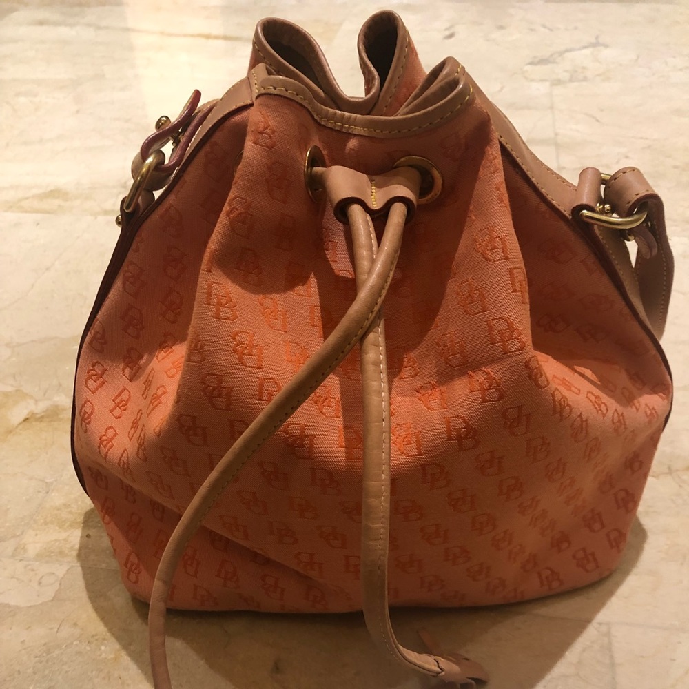 Brand new Dooney and Burke orange bucket purse